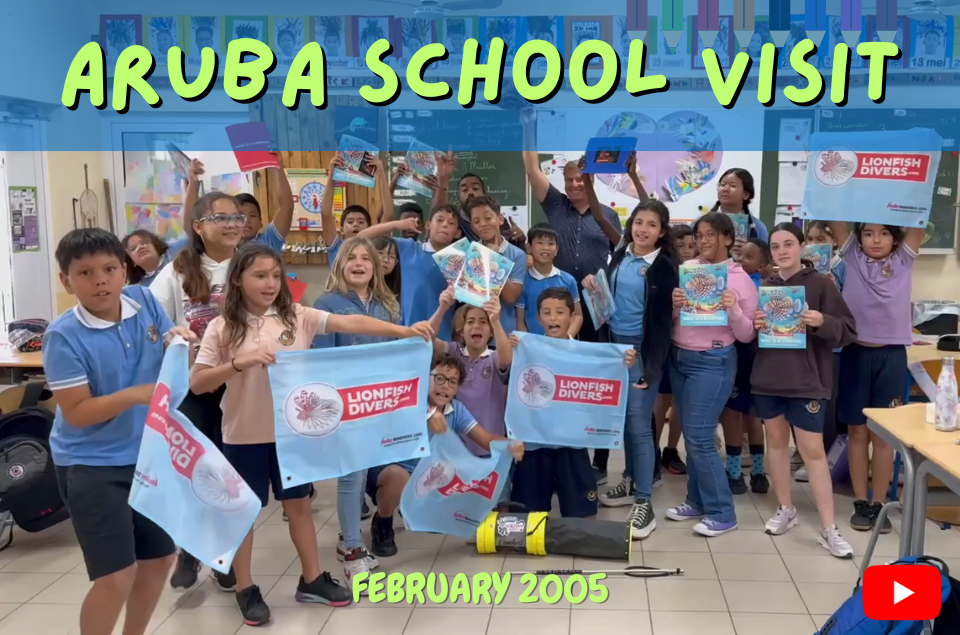 Roger Muller, Jr. showing classroom of kids a lionfish